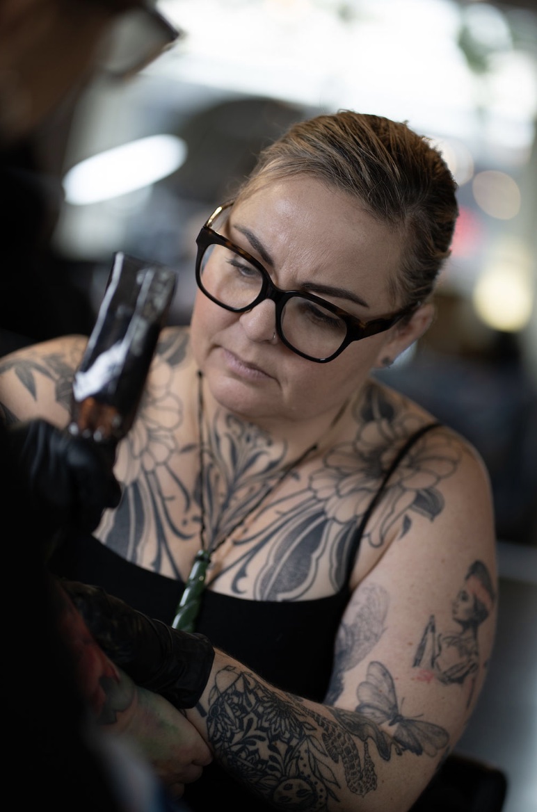 Lisa Booth tattooing in the studio